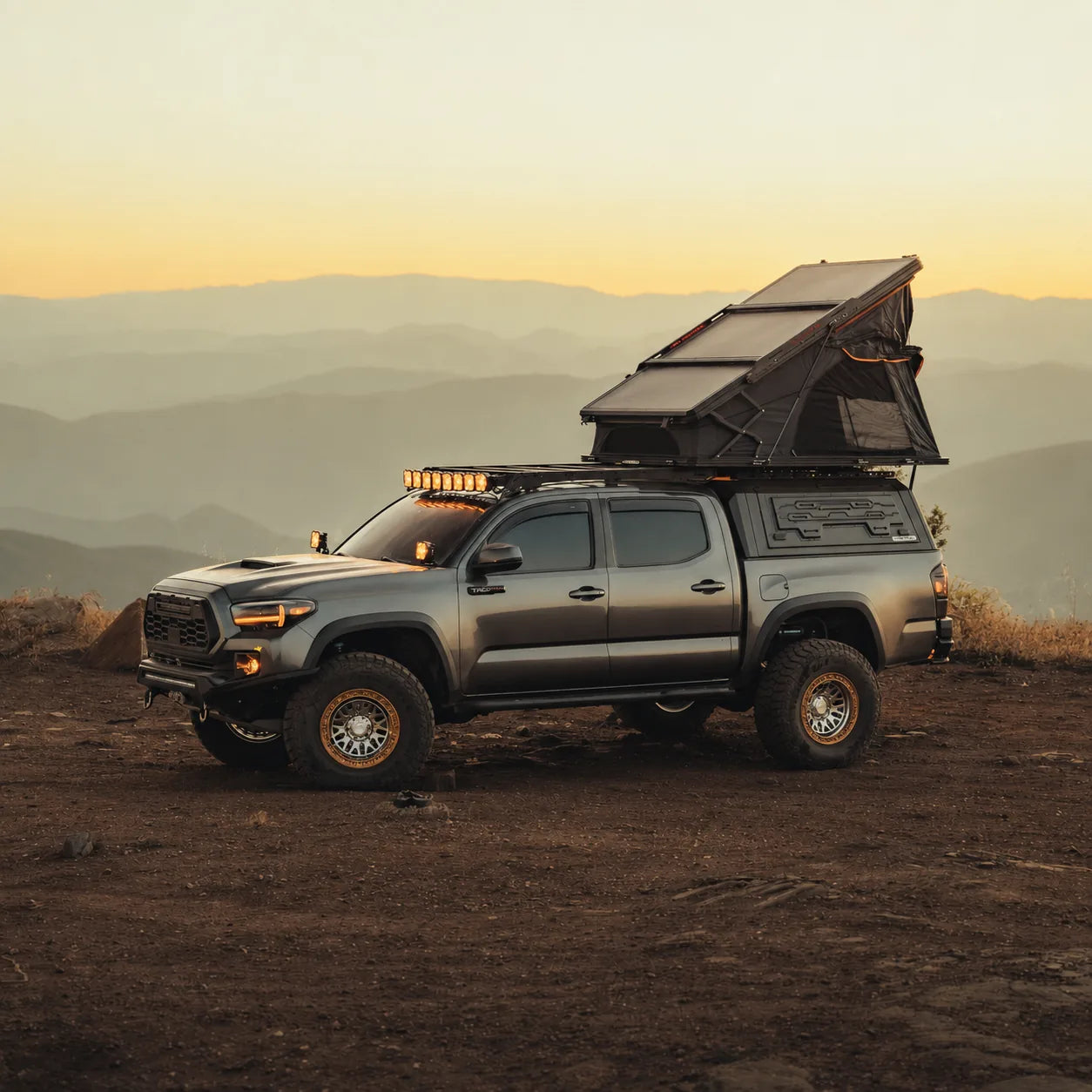 Truck Cap, PeakRoof LT, and Crossbars overland camp setup
